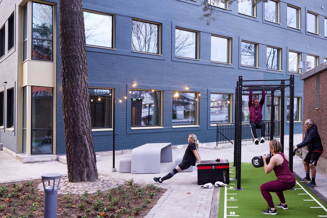 People working out in the outdoor gym.