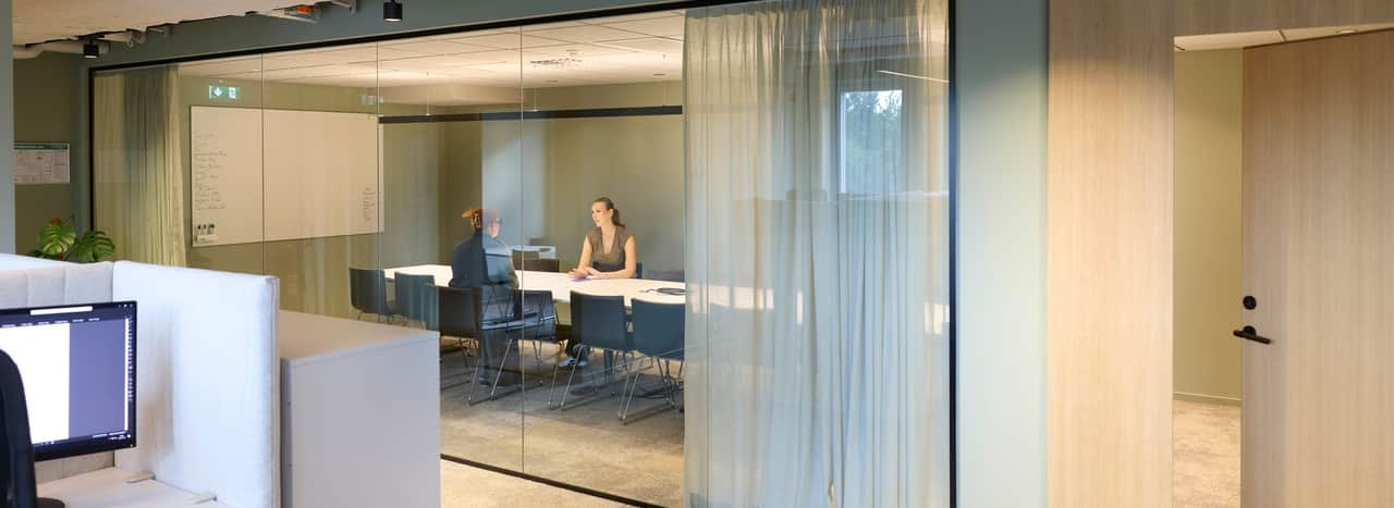 Two people riding bikes.