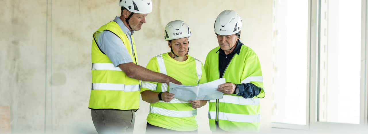 Person smiling at another person across the table.