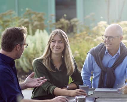 Person talking on the phone in a sofa.