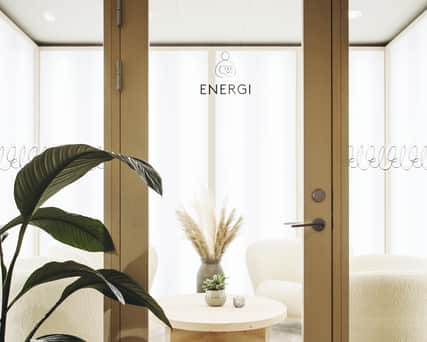 Two people riding on bikes.