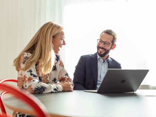 Person writing on a notepad.