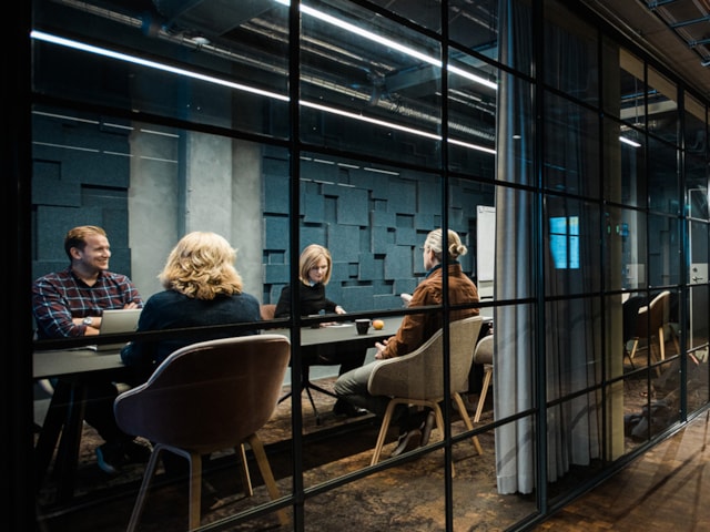 People sitting in a conference room.