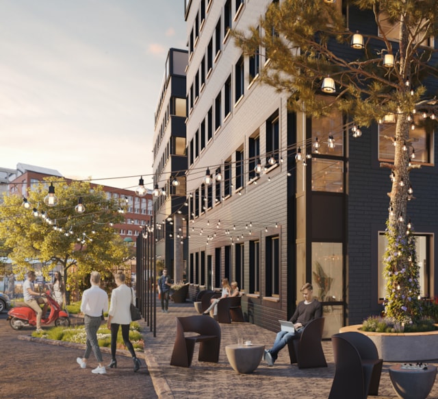 Vision image of people walking in front of a building.