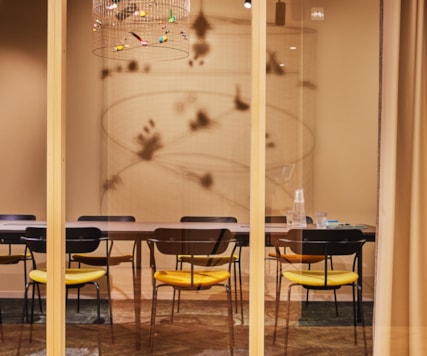 A meeting room behind glass walls.