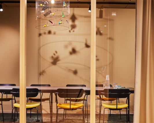 A meeting room behind glass walls.