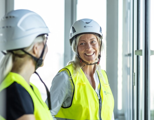 Two people in safety wear.