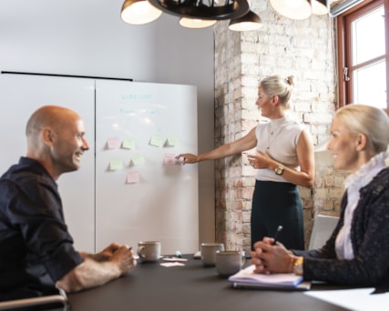 Three people in an office.