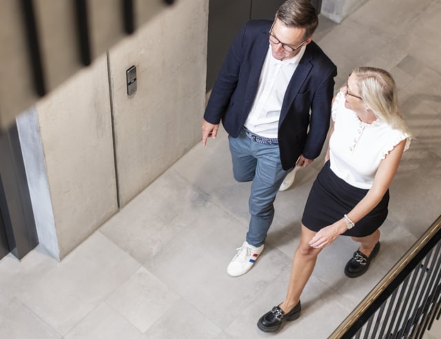 Two people walking from above.