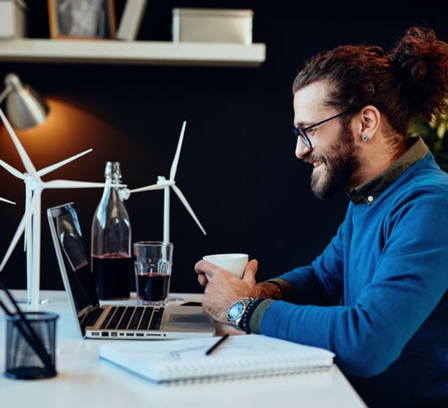 A person sitting with a laptop.