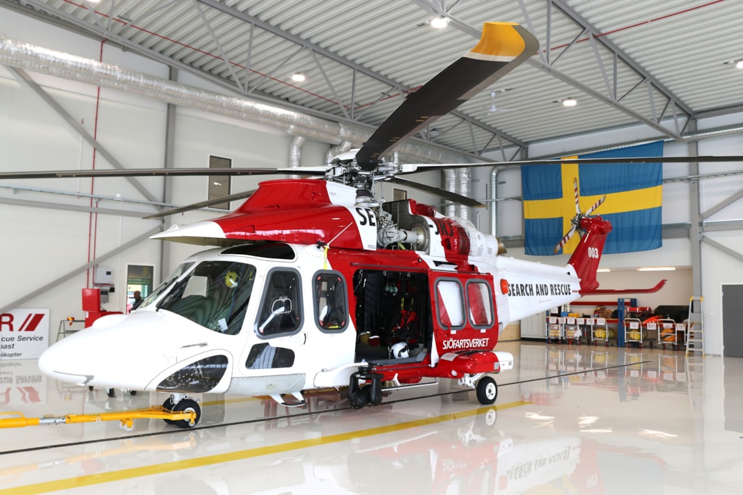 A helicopter inside a hangar.