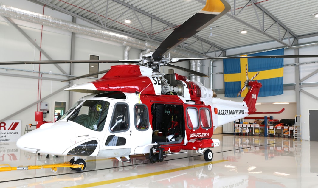 A helicopter inside a hangar.