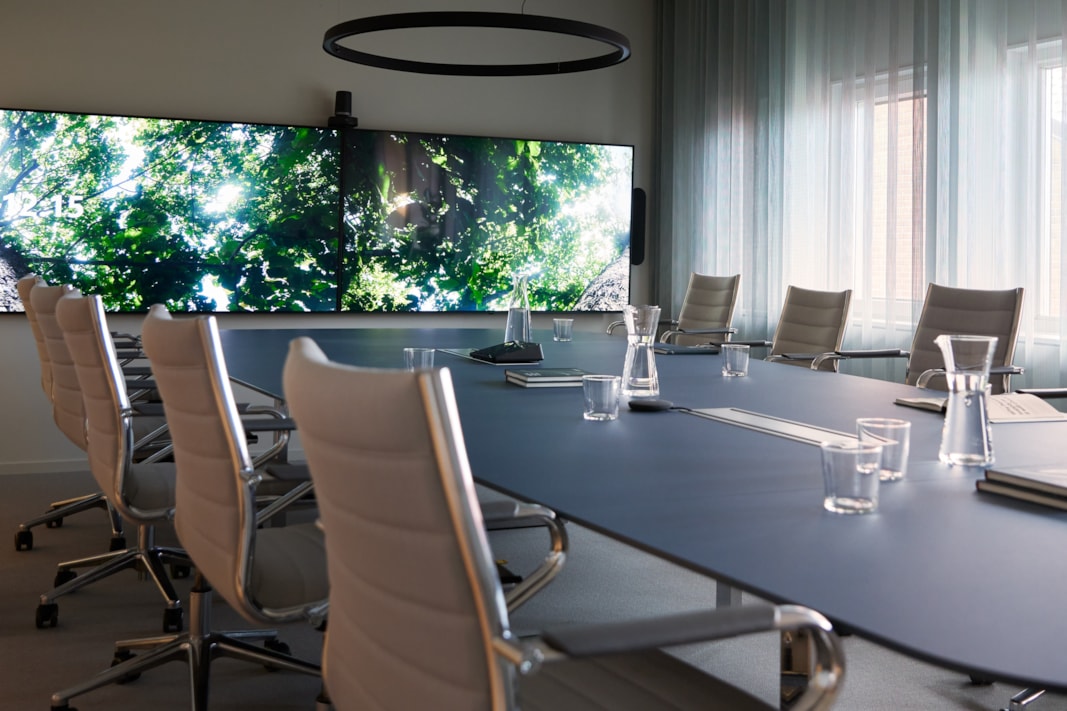 Conference room with a screen on the wall.